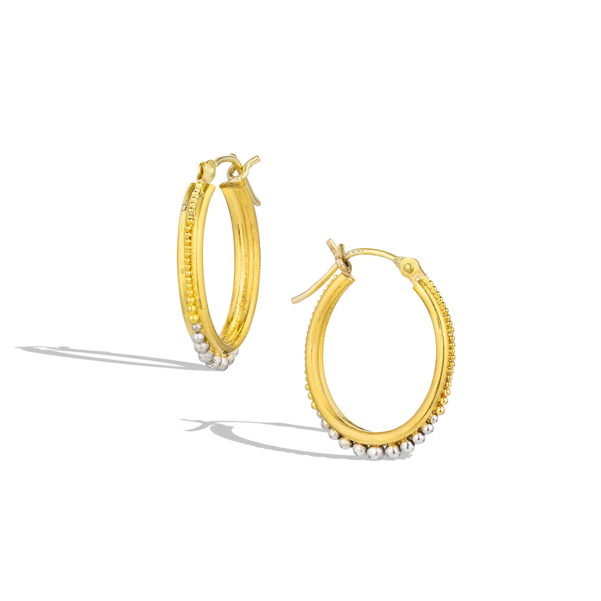 Graduated granulation in gold and platinum has become one of our signatures. The rich, warm tones of the high karat gold and polished platinum lend both a classic and contemporary feel, the granulation that ooh! factor. Ideal for everyday wear by themselves, pair with a charm to move into dressier occasions. Diameter approximately 19.8mm, W 2.6mm (D .8in W .1in).

Made from recycled 22k yellow gold and platinum.