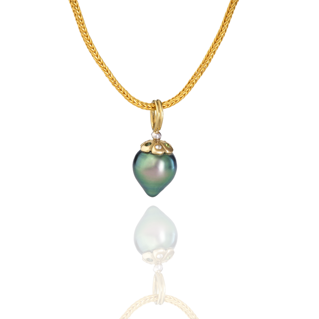 The Bejeweled Silvery Green Teardrop charm on a handwoven chain.