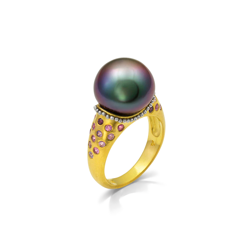 A moody iridescent purple toned Tahitian pearl is encircled by a collar of softly polished platinum granulation. Lavender and purple toned Malawi sapphires and purplish red Anthill garnets continue the moody theme and complement the pearl's subtle iridescence.

One-of-a-kind.