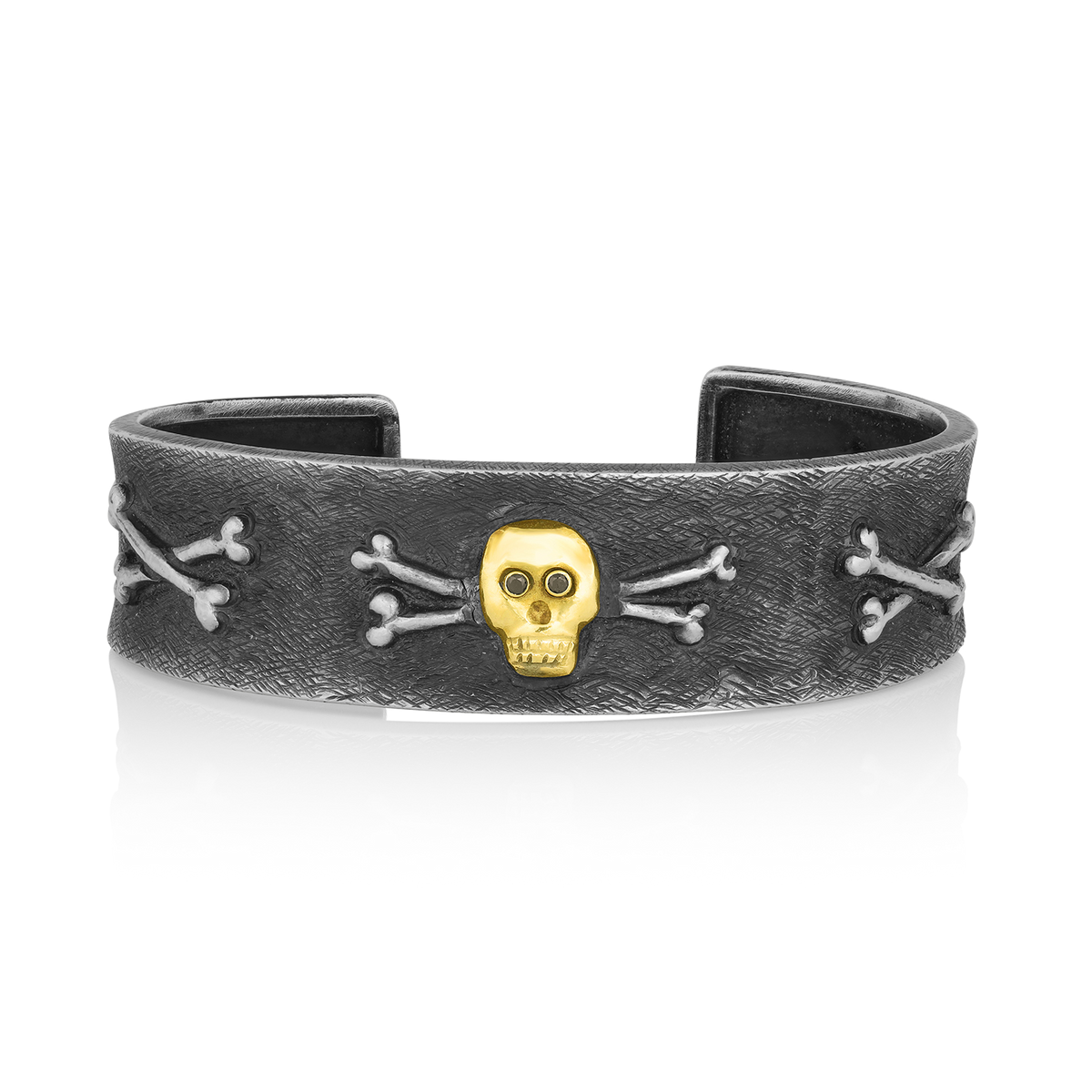 One of our most popular cuff bracelets began life as a sketch of the skull and crossbones on a client's favorite pair of socks. Those who order The Skull Bracelet find that it becomes exceptionally well-traveled as it rarely leaves their wrists. One such journey had a small child, seated next to a proud owner, lean over to her father and ask "Daddy, is that man a pirate?" Enough said.

Handmade to order. Please allow 6-8 weeks for its creation.