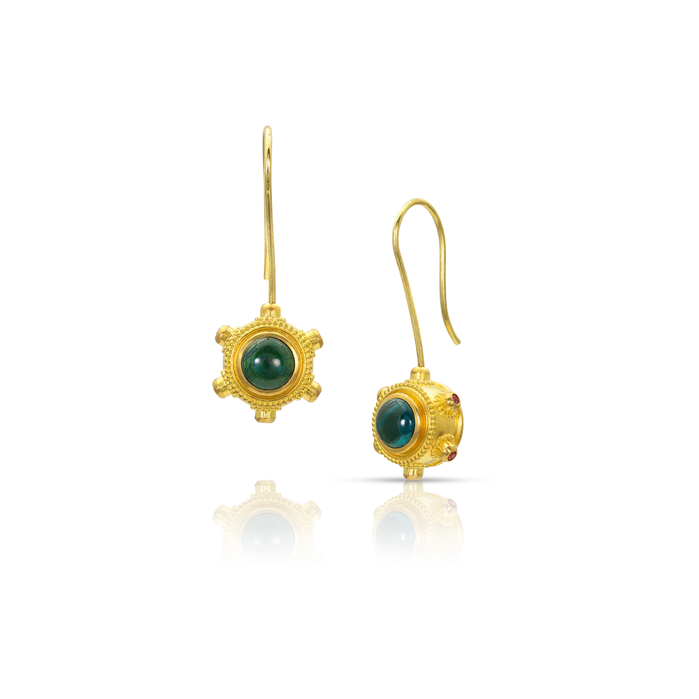 Full of movement, these earrings display a tableau of minute gold granules inspired by the craft and complex metalwork of the ancient Etruscans. Here, the complexity has been reimagined for modern wear, with distinctly un-Etruscan hexagonal looking drops that swivel on long French ear wires. The deep blue tourmalines have neon pink spinel studs set around them to provide a discreet pop of color. Made from recycled 22k gold, Brazilian tourmaline(1.46ct) & Burmese spinel (.18ct). Length 35 mm/1.38 inches