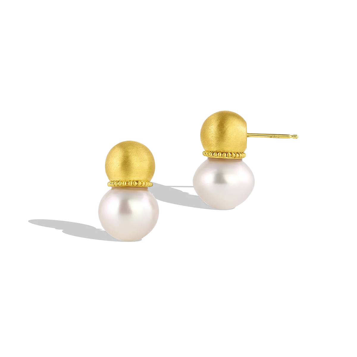 Hollow golden spheres edged with a delicate ruff of golden granulation and set with lustrous baroque South Sea pearls. The warm buttery tones of the yellow gold give an antique yet contemporary feel, a pearl aficionado's choice for everyday wear. These uniquely shaped and versatile earrings can be worn as ear climbers or as a drop, for climbers, simply turn the pearls downwards. Length approximately 22mm W 13mm (L .8in W .5in).

Made in recycled 22k yellow gold and 13mm Australian Paspaley South Sea pearls.