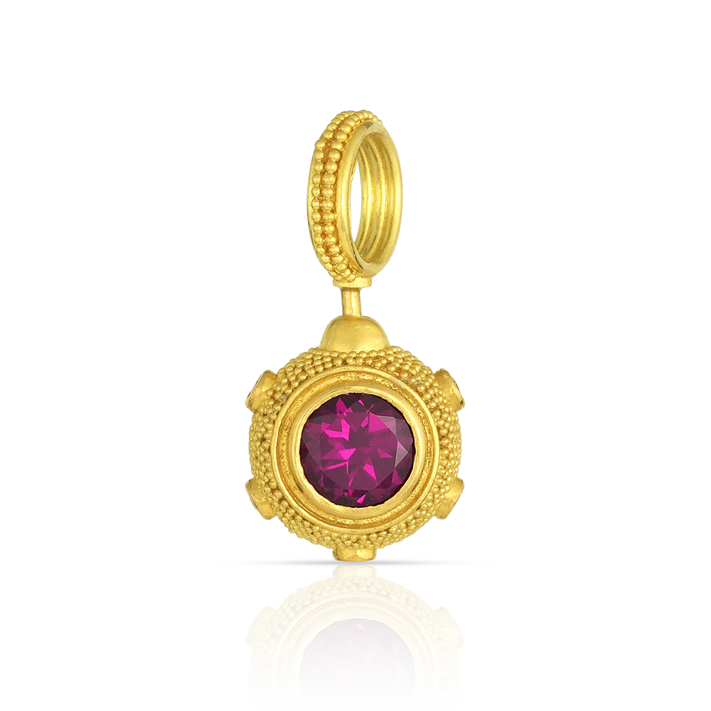 View of the Velvet Swivel Mine charm from the back, showing the flat set rhodolite garnet. 
