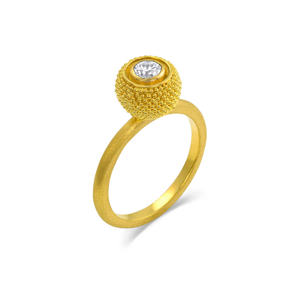 Inspired by the goldsmiths of antiquity, who used gold granules to paint scenes and tableaux on their work, this elegant and versatile ring has the silky appearance of a soft, rounded velvet cushion. The gold is smooth and almost soft to the touch, and a discreet diamond sparkle make it a perfect choice for frequent wear. A parchment like texture gives the ring band a soft parchment like feel.

Made in recycled 22k yellow gold an antique diamond (F-G VS, .25ctw). Size 7. Can be resized.