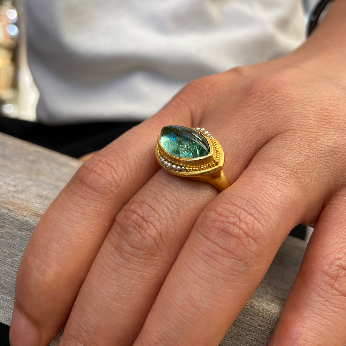 Green blue Nerrena ring on model.