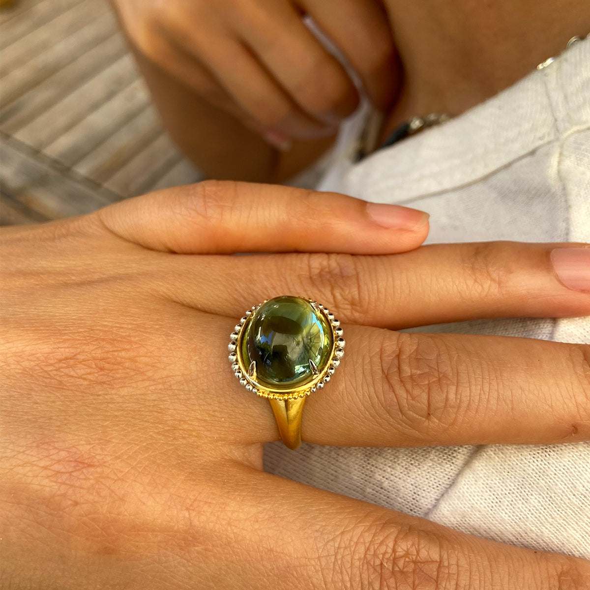 Sea green Ora ring on model.