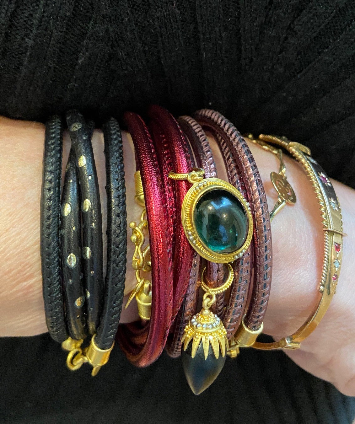 The Rock Crystal Spider charm worn on a bracelet.