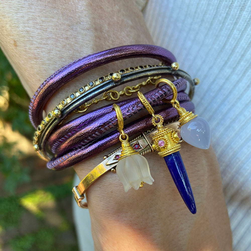 Lapis charm on model.